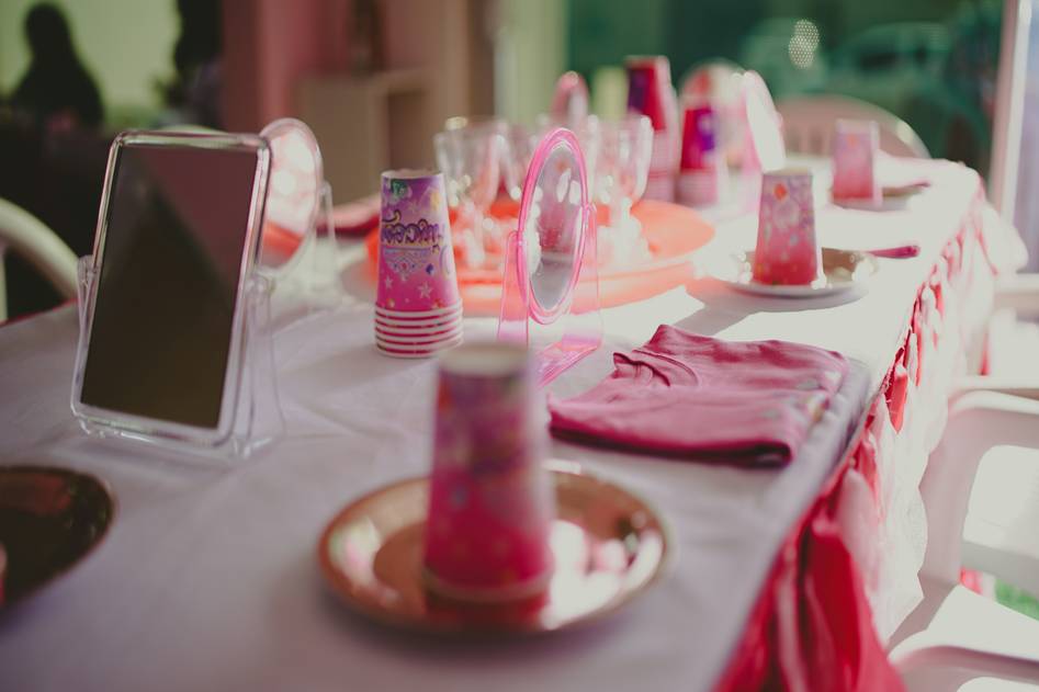 Elegant floral centerpiece with candles on rustic wooden table