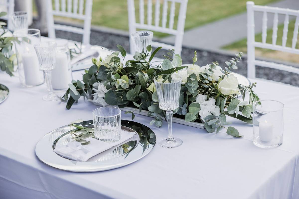 Eco-friendly wedding centerpiece using potted herbs and recyclable materials demonstrating how to create centerpieces for weddings sustainably